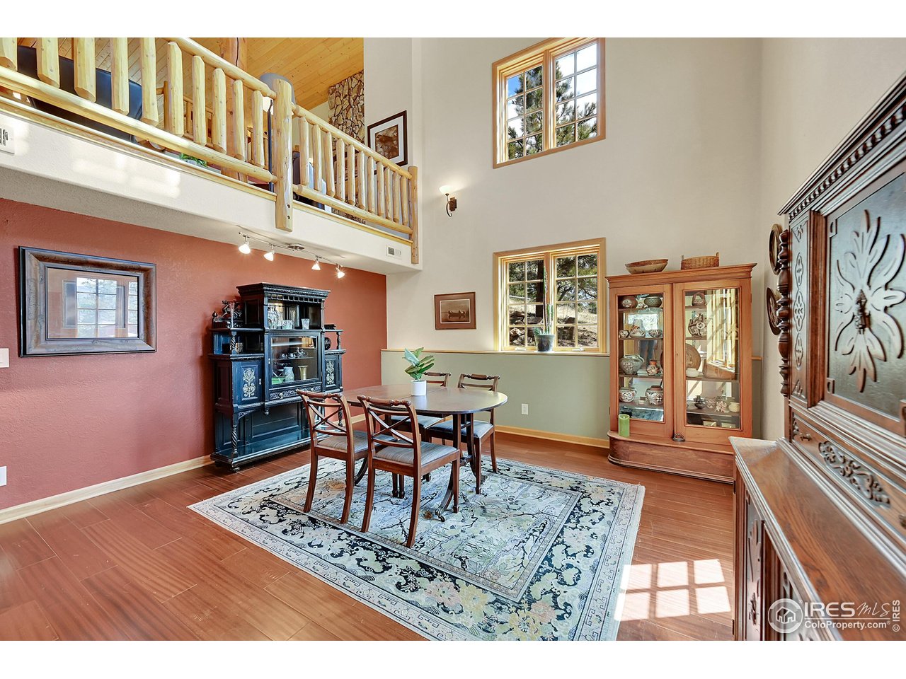 1319 County Road 83 Boulder, CO 80302 - Photo 11 of 30 a dining room with wooden floor and large windows
