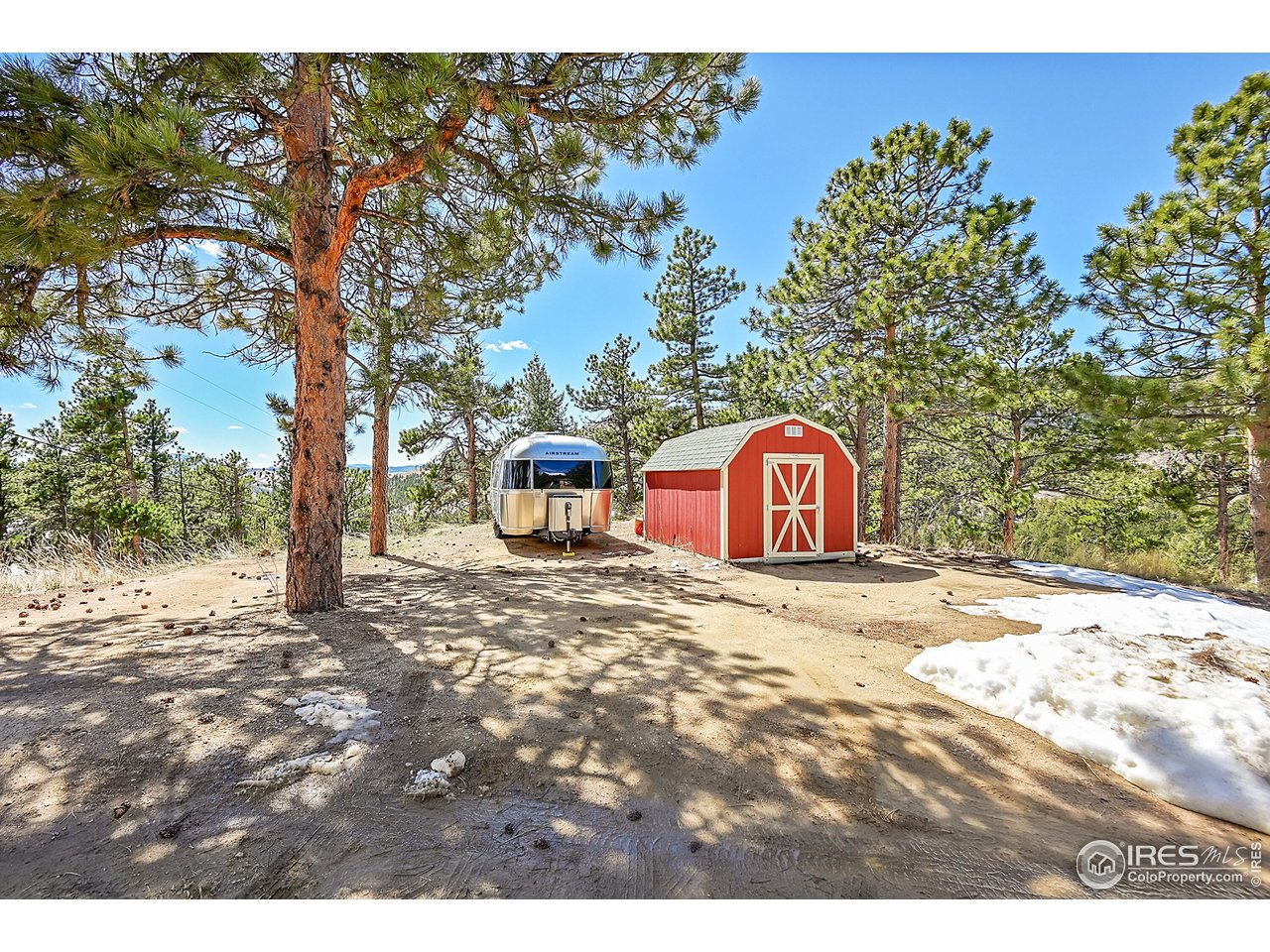 1319 County Road 83 Boulder, CO 80302 - Photo 24 of 30 a view of a wooden house with a yard