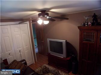 23 Tweed Road Levittown, PA 19056 - Photo 12 of 12 a view of a livingroom with furniture and staircase