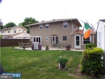 23 Tweed Road Levittown, PA 19056 - Photo 3 of 12 a backyard of a house with table and chairs