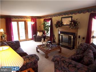 23 Tweed Road Levittown, PA 19056 - Photo 4 of 12 a living room with furniture and a fireplace