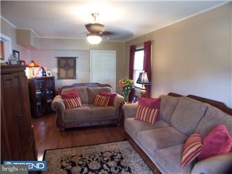 23 Tweed Road Levittown, PA 19056 - Photo 9 of 12 a living room with furniture and a couch