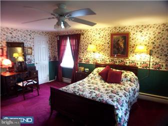 23 Tweed Road Levittown, PA 19056 - Photo 10 of 12 a bed sitting in a bedroom next to a window