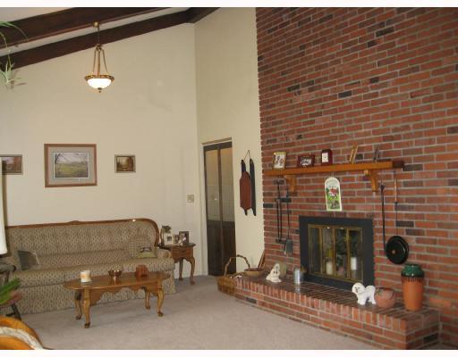 616 Bower Hill Road Venetia, PA 15367 - Photo 2 of 8 Living Room. This spacious living room has large windows, floor-to-ceiling brick fireplace, valted wood beamed ceilings.