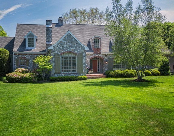 7 Brent Road Lexington, MA 02420 - Photo 2 of 14 a front view of a house with garden