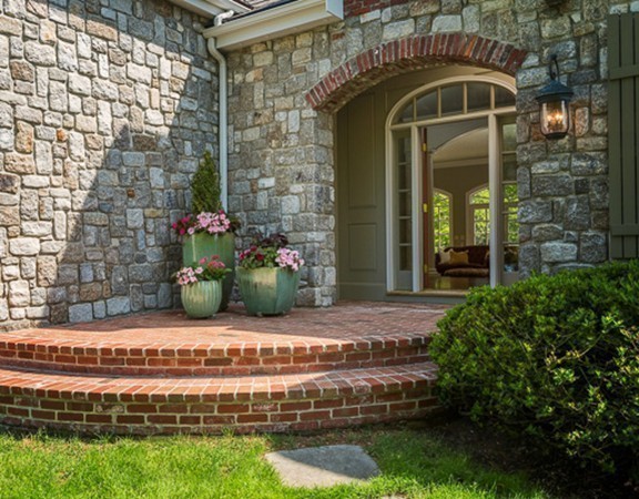 7 Brent Road Lexington, MA 02420 - Photo 3 of 14 a front view of a house with a porch