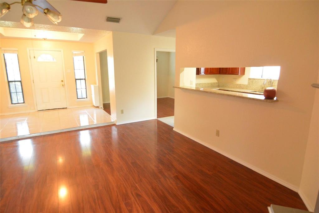 210 Apollo Road Garland, TX 75040 - Photo 22 of 23 Wood-finish flooring throughout the main living area