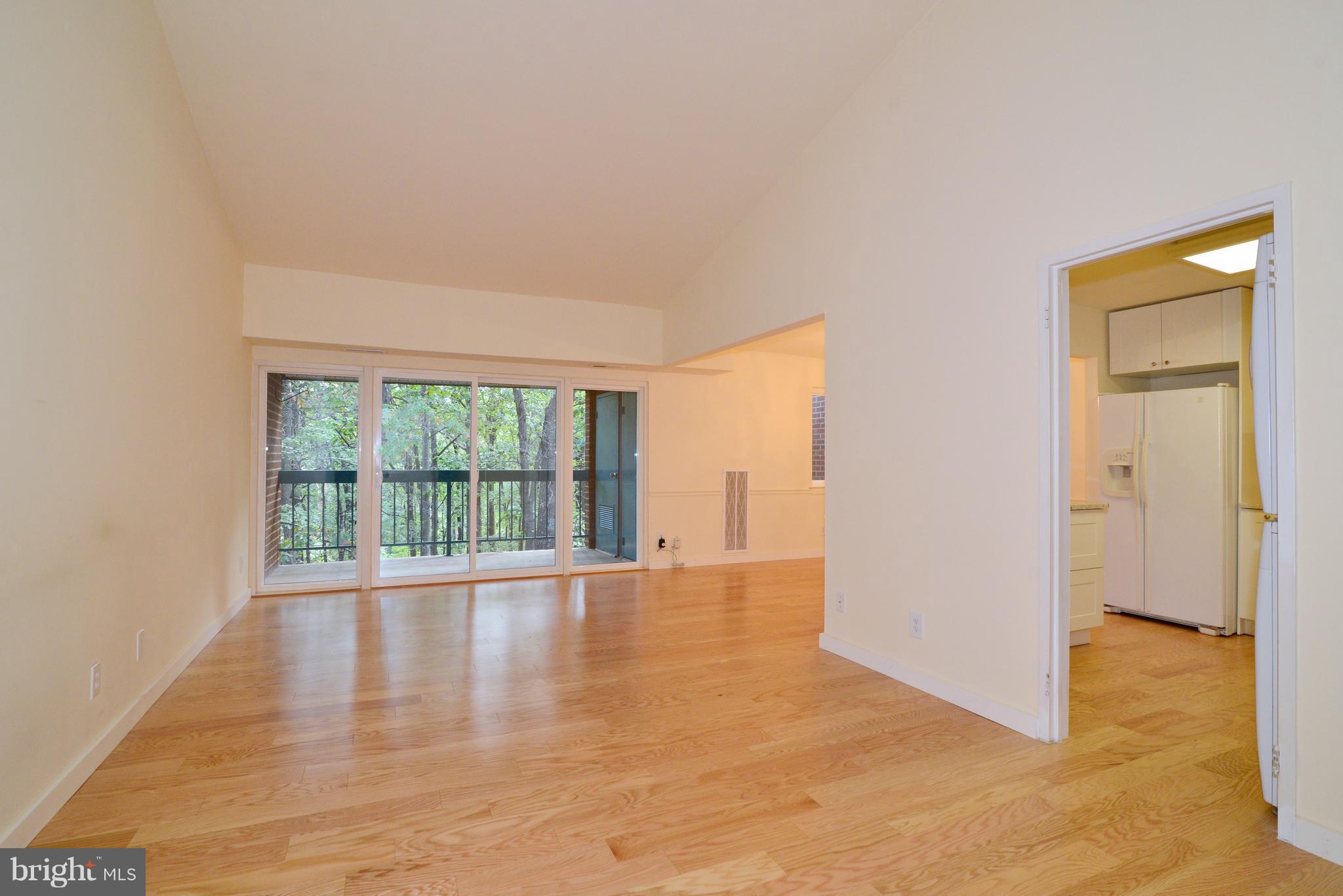 11803 Breton Court, Unit 32C Reston, VA 20191 - Photo 2 of 23 a view of an empty room with a window