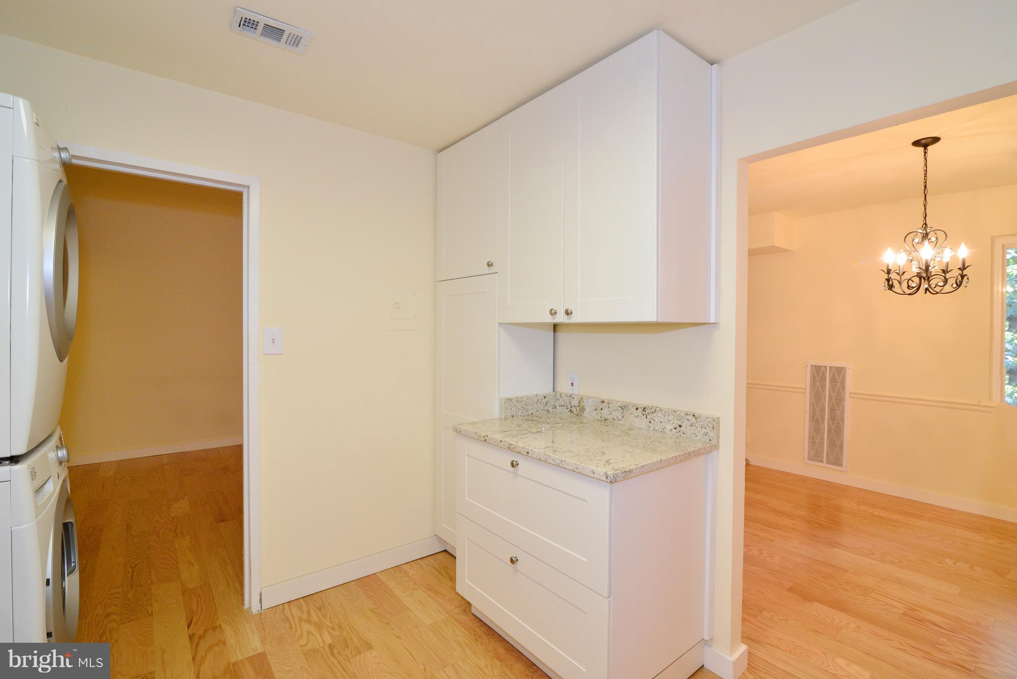 11803 Breton Court, Unit 32C Reston, VA 20191 - Photo 12 of 23 a bathroom with a granite countertop sink and a mirror