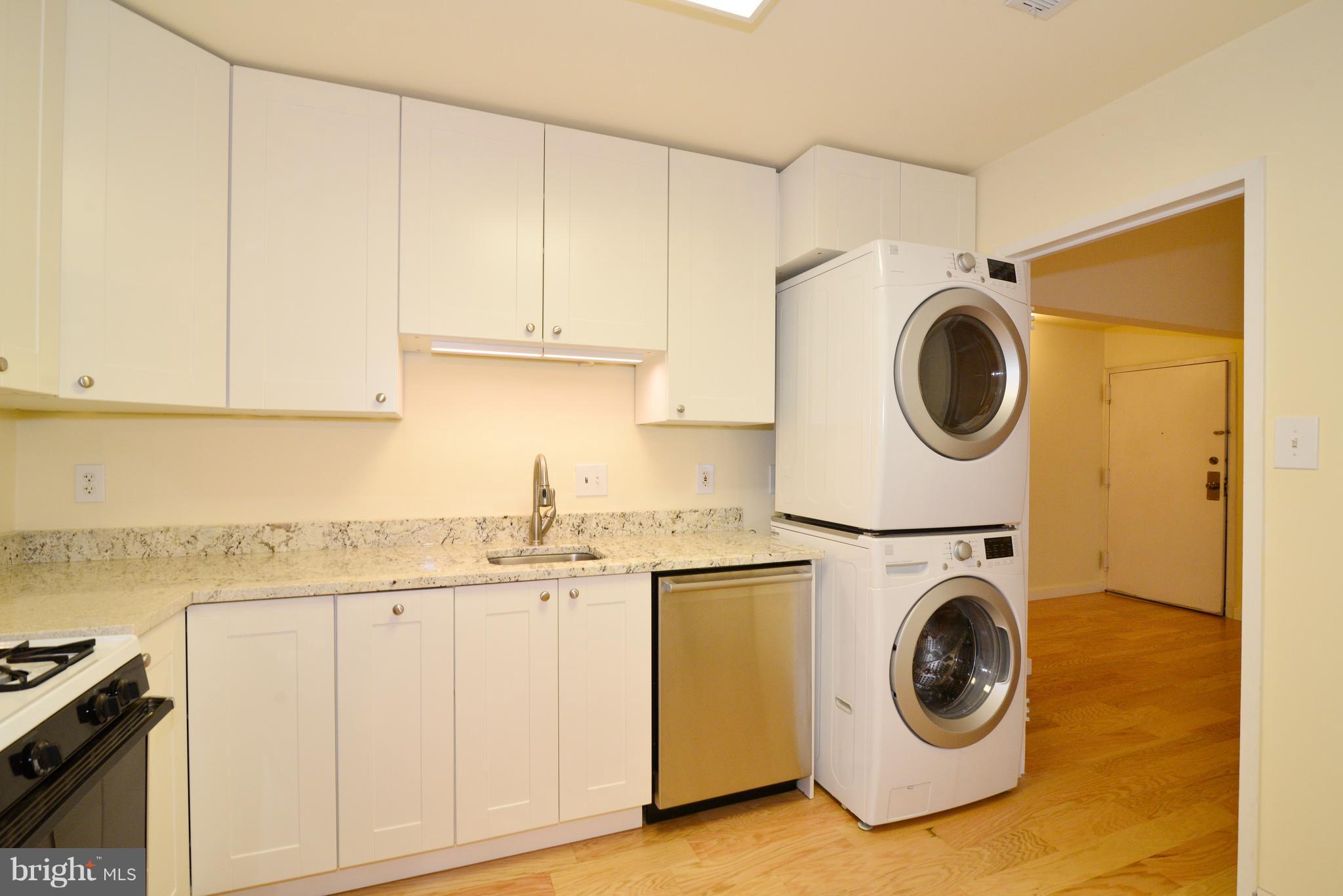 11803 Breton Court, Unit 32C Reston, VA 20191 - Photo 13 of 23 a utility room with sink dryer and washer