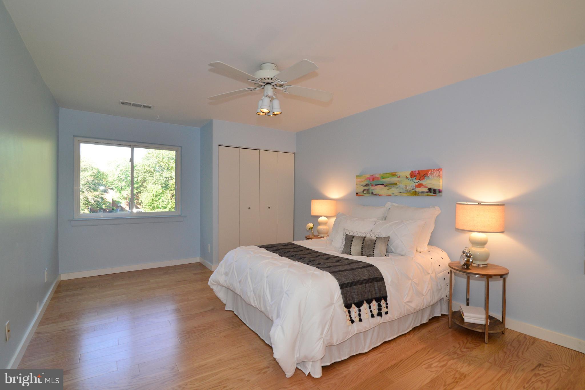 11803 Breton Court, Unit 32C Reston, VA 20191 - Photo 14 of 23 a bedroom with a bed and window