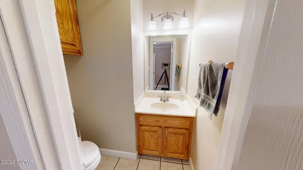 a view of room with window and ceiling fan