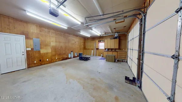 a view of backyard of house garage