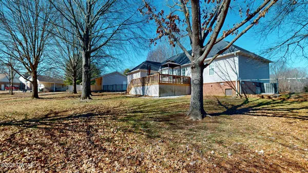 an aerial view of a house with a swimming pool