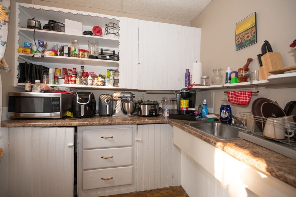 39 King Philip Road Worcester, MA 01606 - Photo 8 of 13 a kitchen with stainless steel appliances granite countertop a sink and a stove