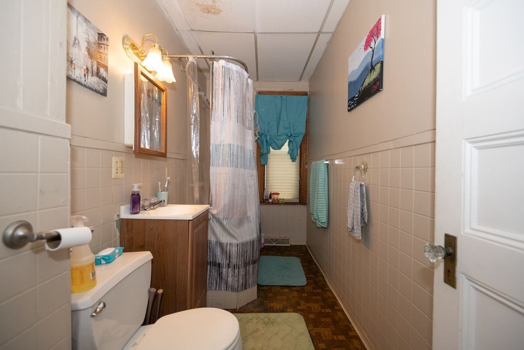 39 King Philip Road Worcester, MA 01606 - Photo 9 of 13 a bathroom with a sink toilet and shower
