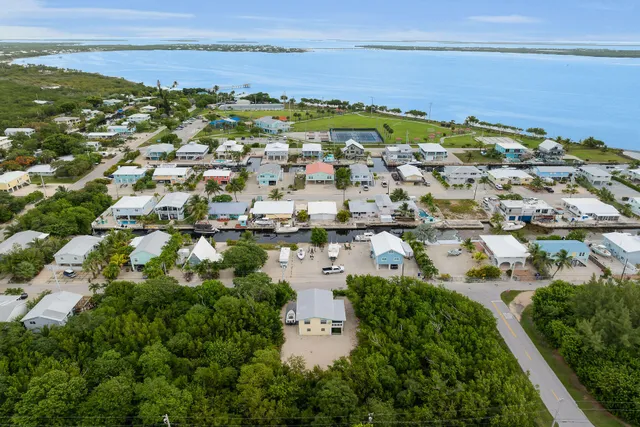 an aerial view of residential building and ocean