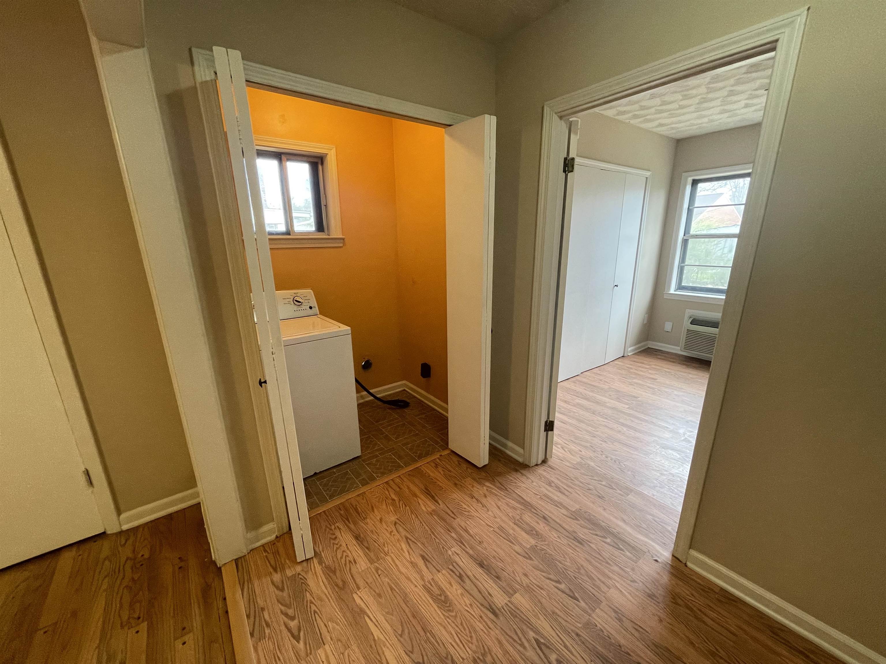 1626 Wheaton Street Memphis, TN 38117 - Photo 7 of 12 a view of a room with wooden floor and a bathroom