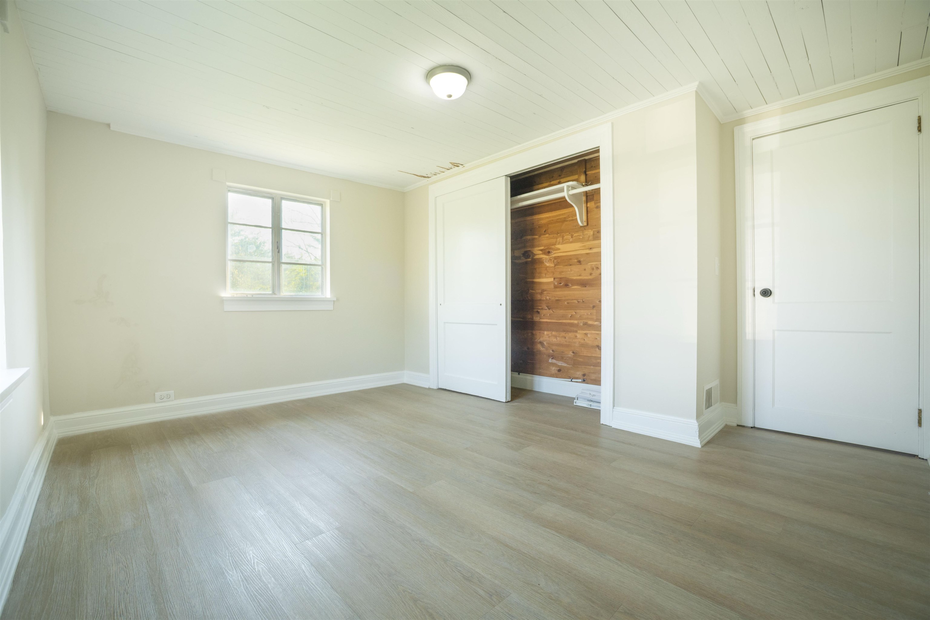 1641 Smithland Road Harrisonburg, VA 22802 - Photo 8 of 44 an empty room with wooden floor and windows