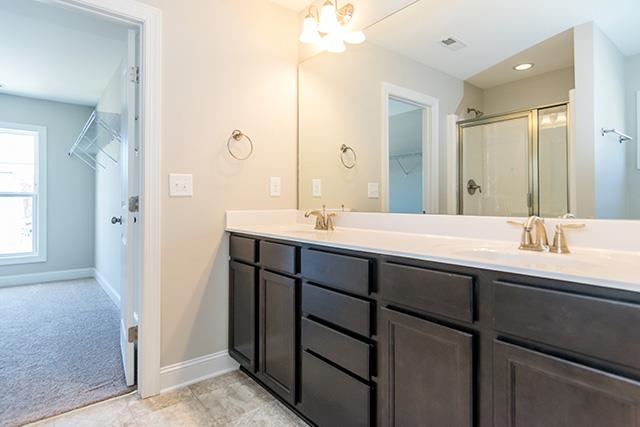3501 Bloomfield Way Raleigh, NC 27616 - Photo 19 of 25 a bathroom with a double vanity sink mirror and double