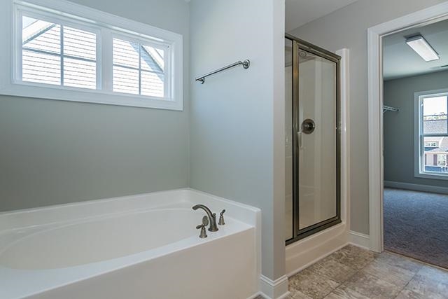 3501 Bloomfield Way Raleigh, NC 27616 - Photo 20 of 25 a bathroom with a bathtub and shower