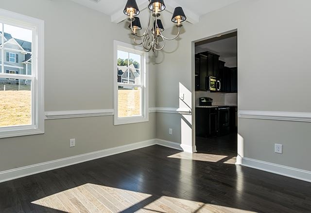 3501 Bloomfield Way Raleigh, NC 27616 - Photo 3 of 25 a view of a room with wooden floor chandelier and windows