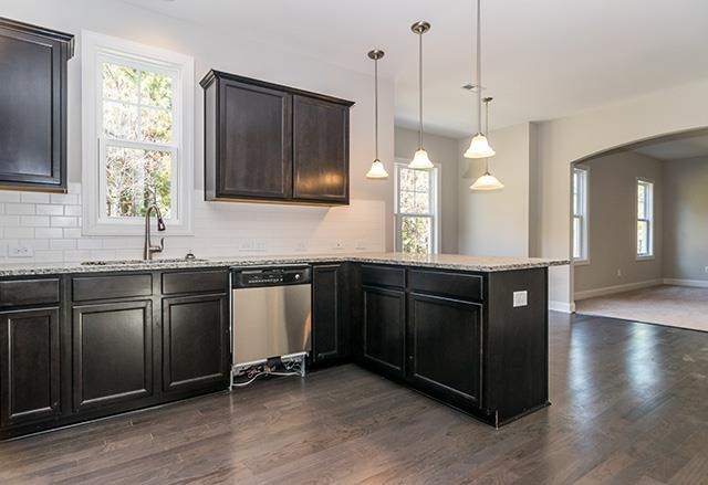3501 Bloomfield Way Raleigh, NC 27616 - Photo 6 of 25 a kitchen with a sink a window and cabinets
