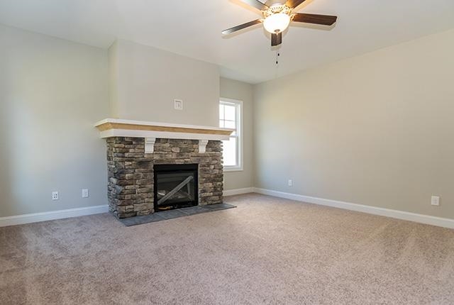 3501 Bloomfield Way Raleigh, NC 27616 - Photo 9 of 25 an empty room with fireplace and fan