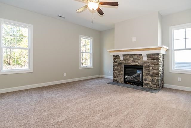 3501 Bloomfield Way Raleigh, NC 27616 - Photo 10 of 25 an empty room with windows and fireplace