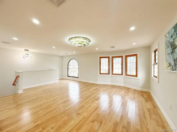 a view of an empty room and a window