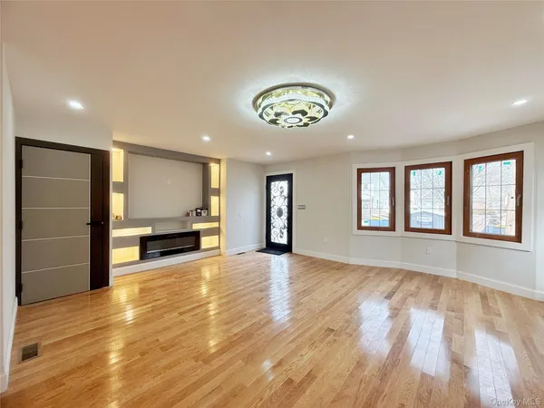 a view of hallway with wooden floor