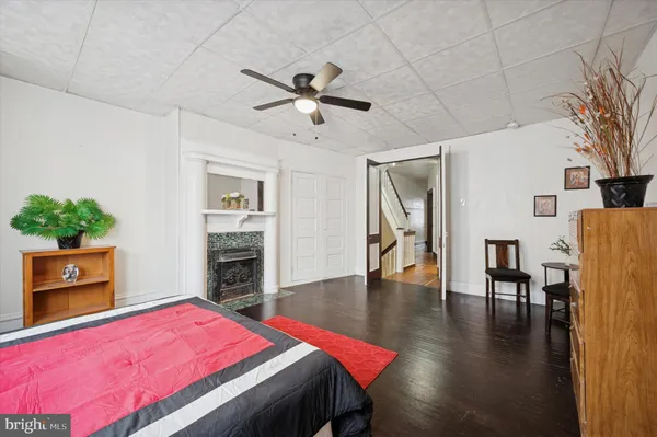 a bedroom with a bed and a fireplace