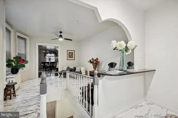 a view of living room with furniture and flowers