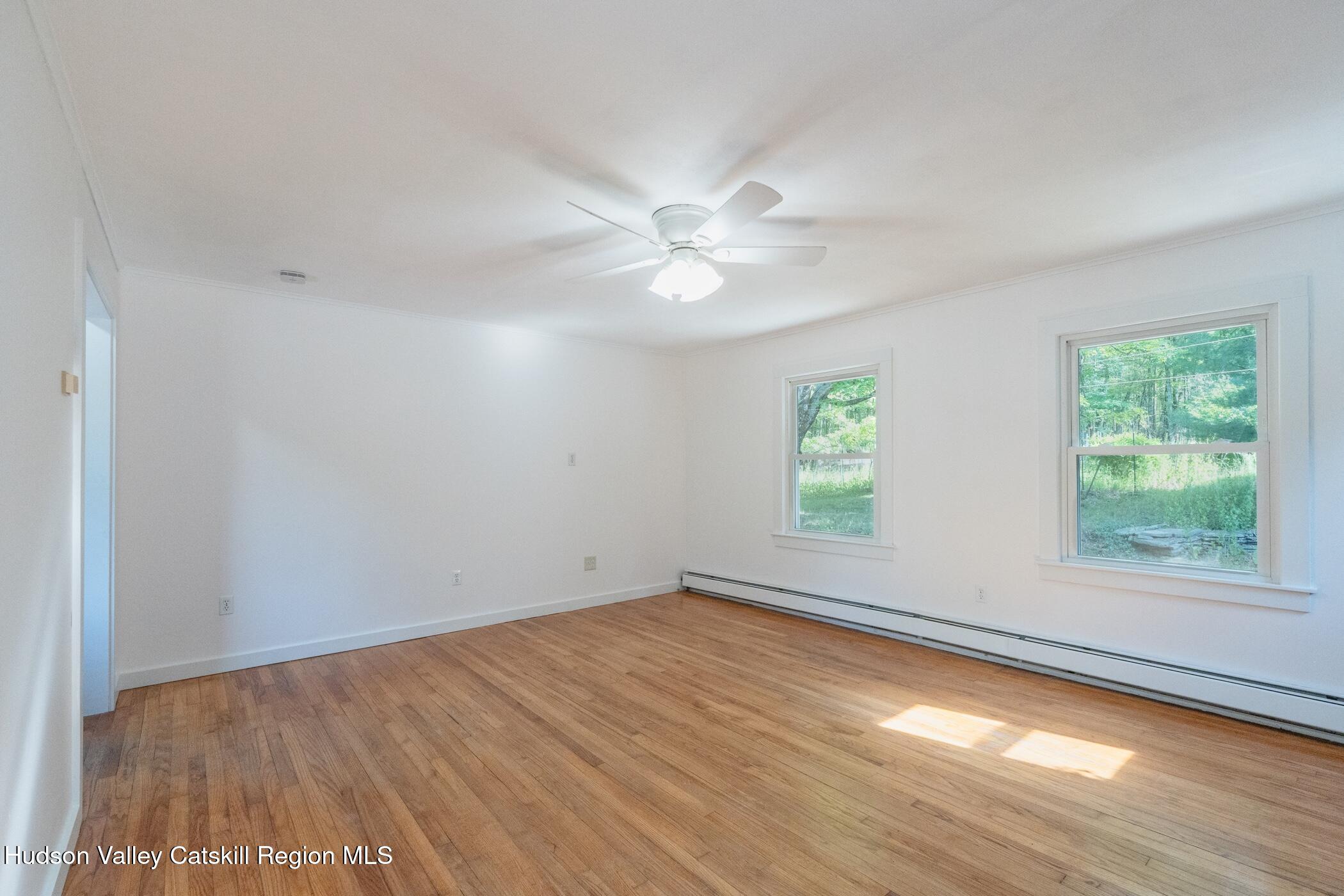 4533 Atwood Road Stone Ridge, NY 12484 - Photo 35 of 63 wooden floor in an empty room with a window