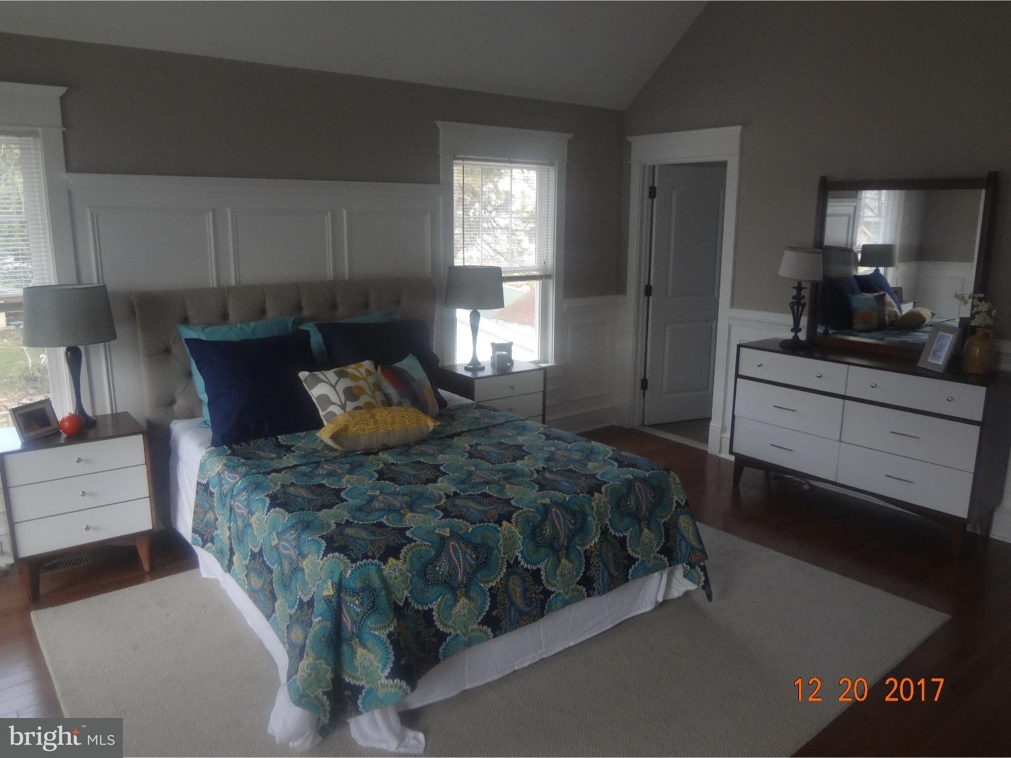 324 Lenox Road Havertown, PA 19083 - Photo 16 of 25 a spacious bedroom with a bed and a dresser in it