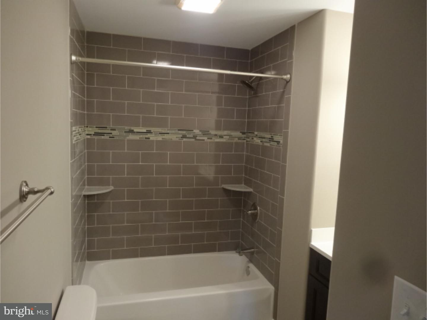 324 Lenox Road Havertown, PA 19083 - Photo 18 of 25 a bathroom with a shower and a bathtub