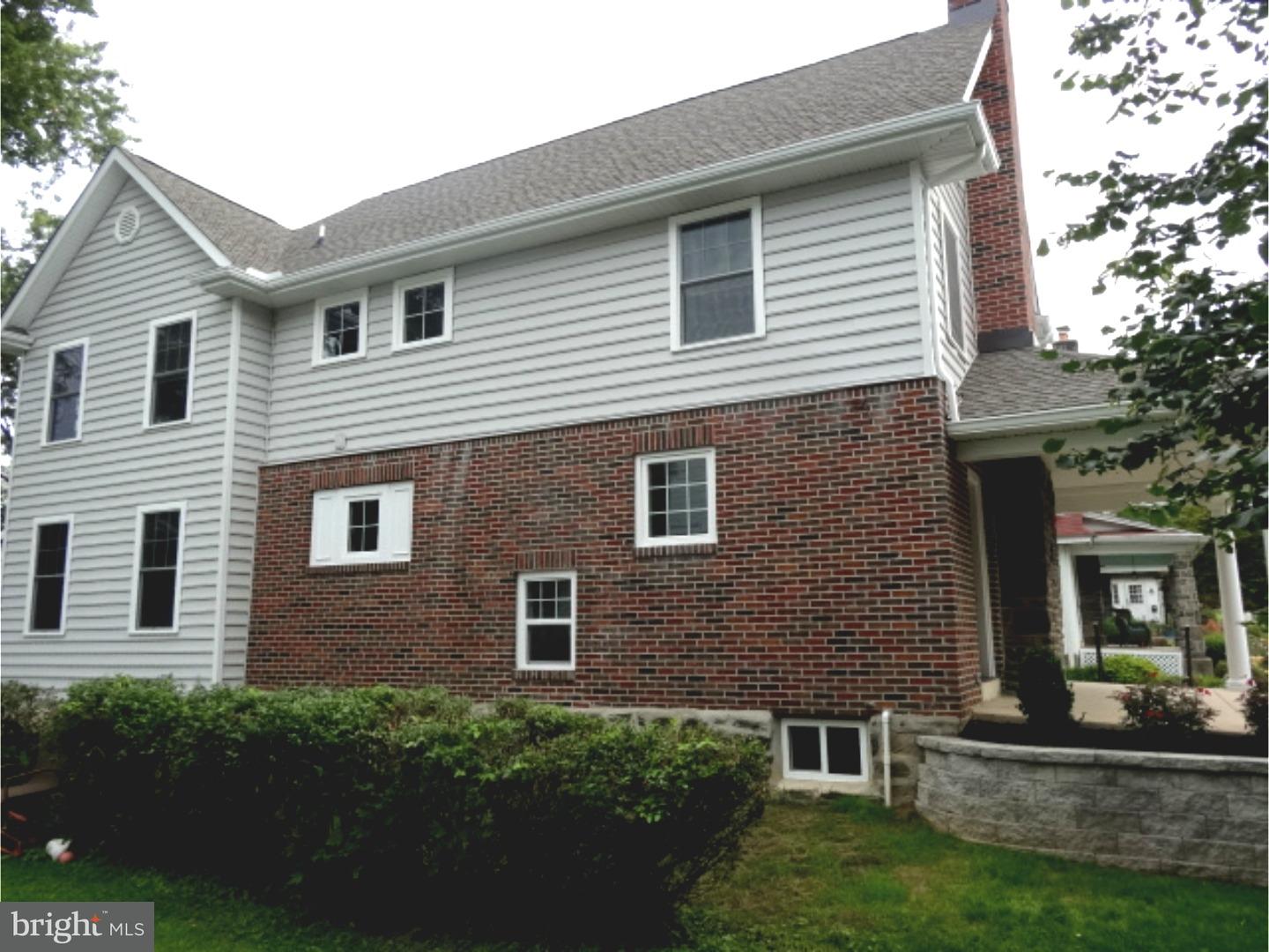 324 Lenox Road Havertown, PA 19083 - Photo 23 of 25 a front view of a house with a yard