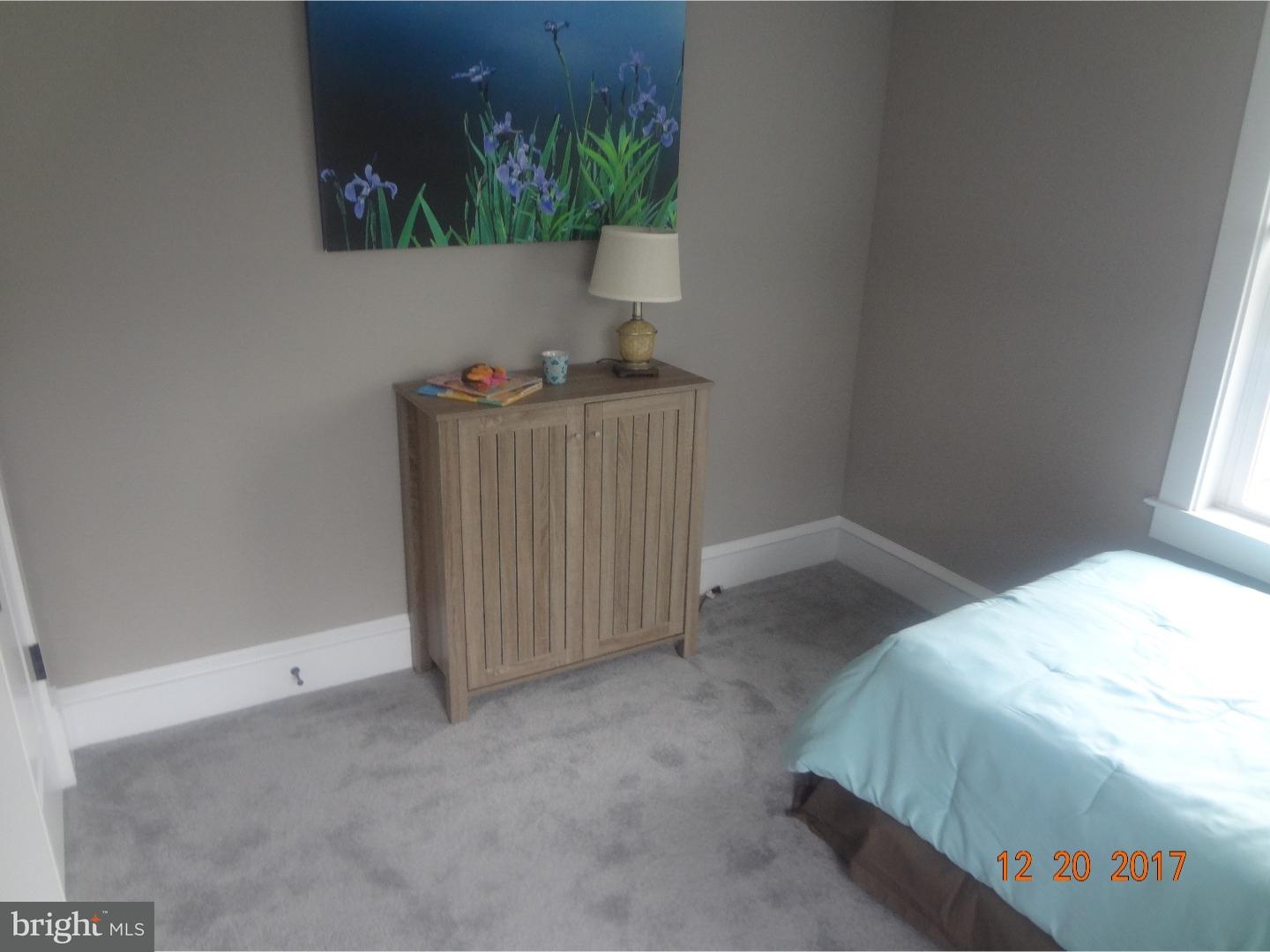 324 Lenox Road Havertown, PA 19083 - Photo 9 of 25 a bedroom with a bed and a potted plant