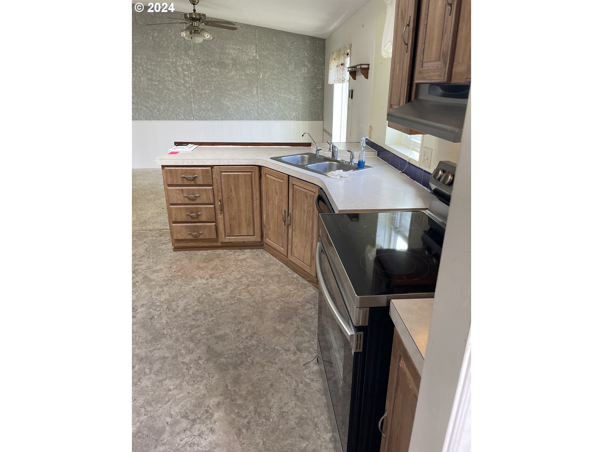 55096 Harrison Road Southwest Bandon, OR 97411 - Photo 11 of 34 a bathroom with a sink a toilet and mirror