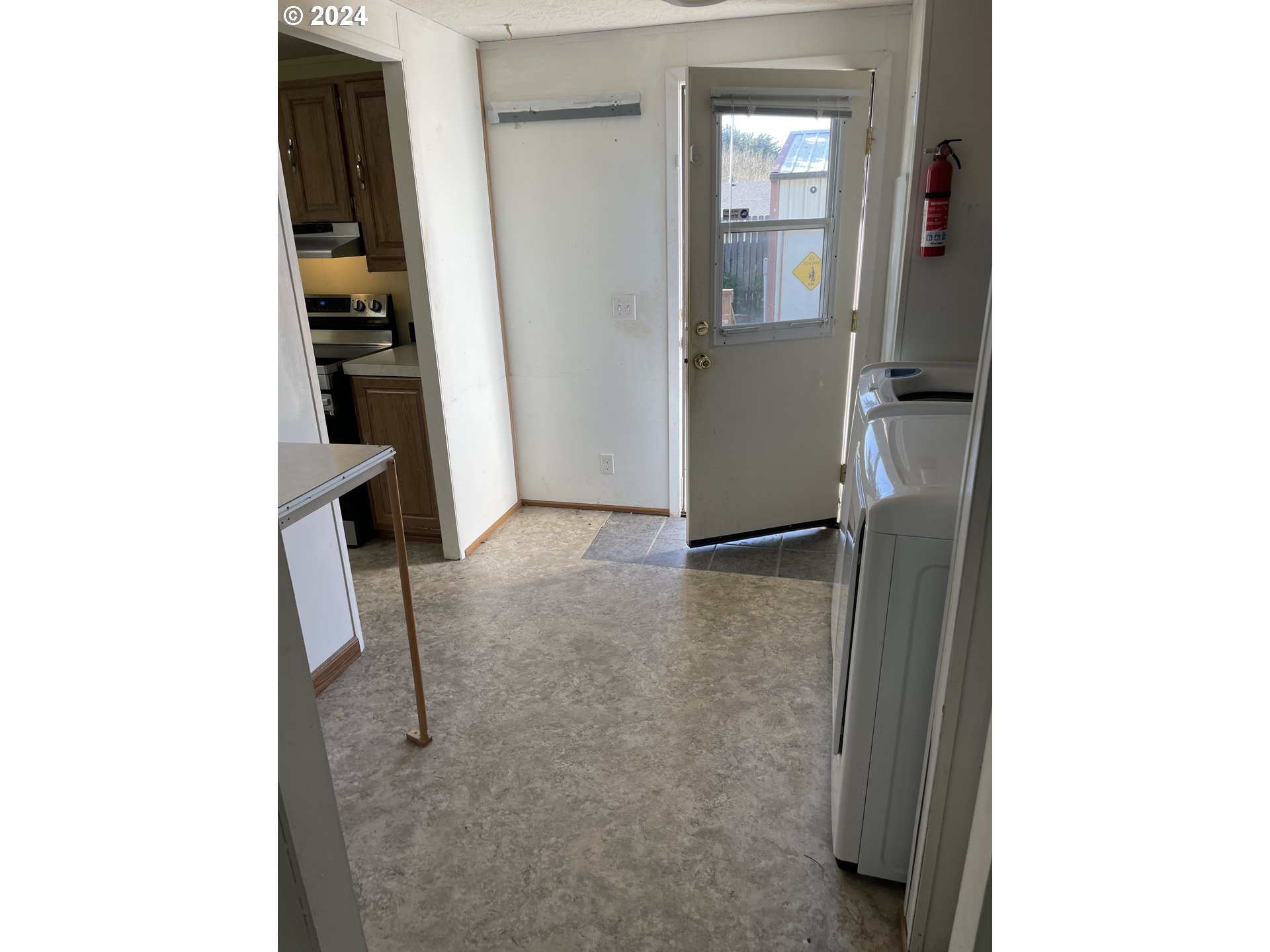 55096 Harrison Road Southwest Bandon, OR 97411 - Photo 14 of 34 a view of a kitchen from the hallway