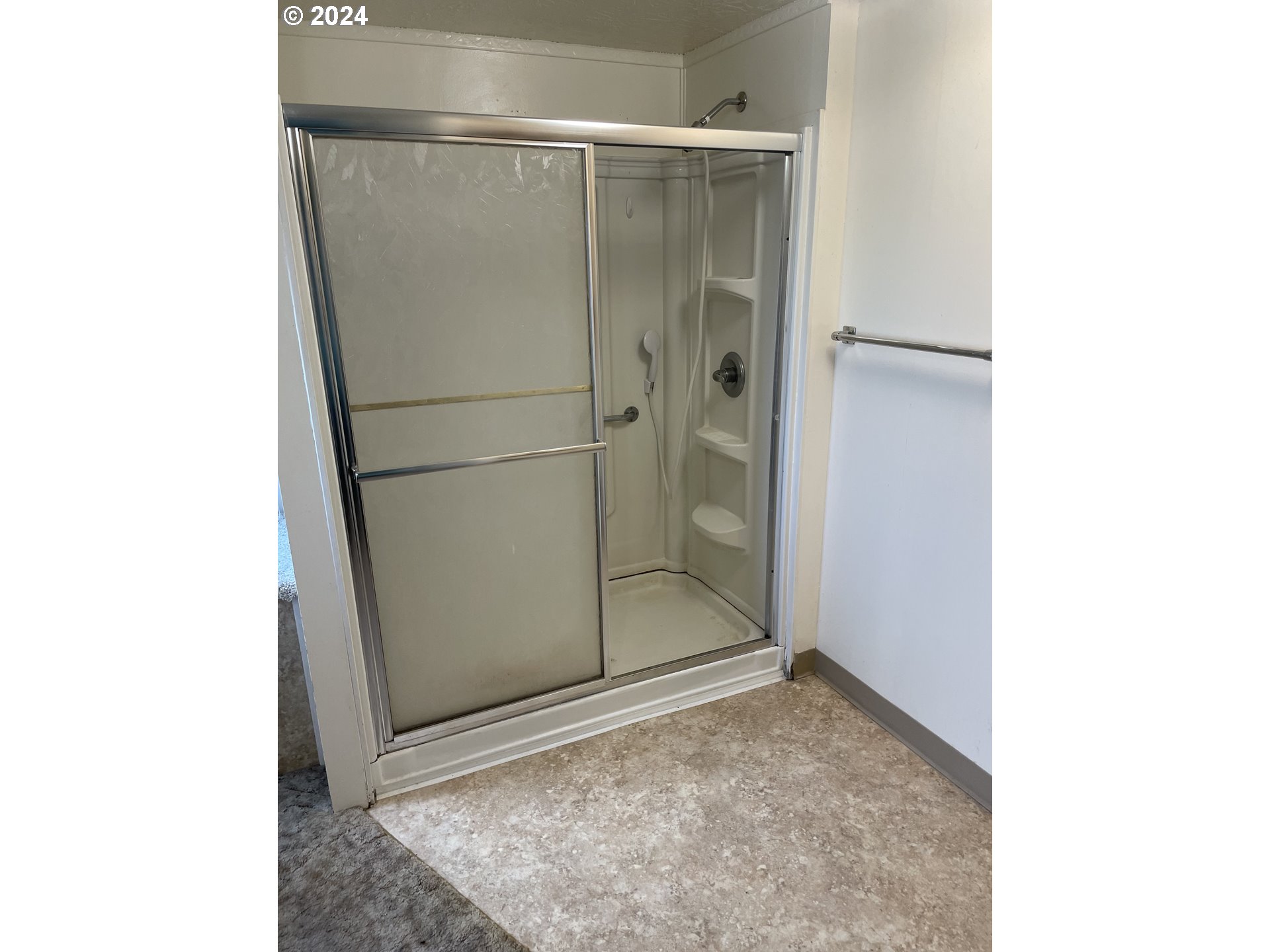 55096 Harrison Road Southwest Bandon, OR 97411 - Photo 19 of 34 a bathroom with a granite countertop shower and a sink