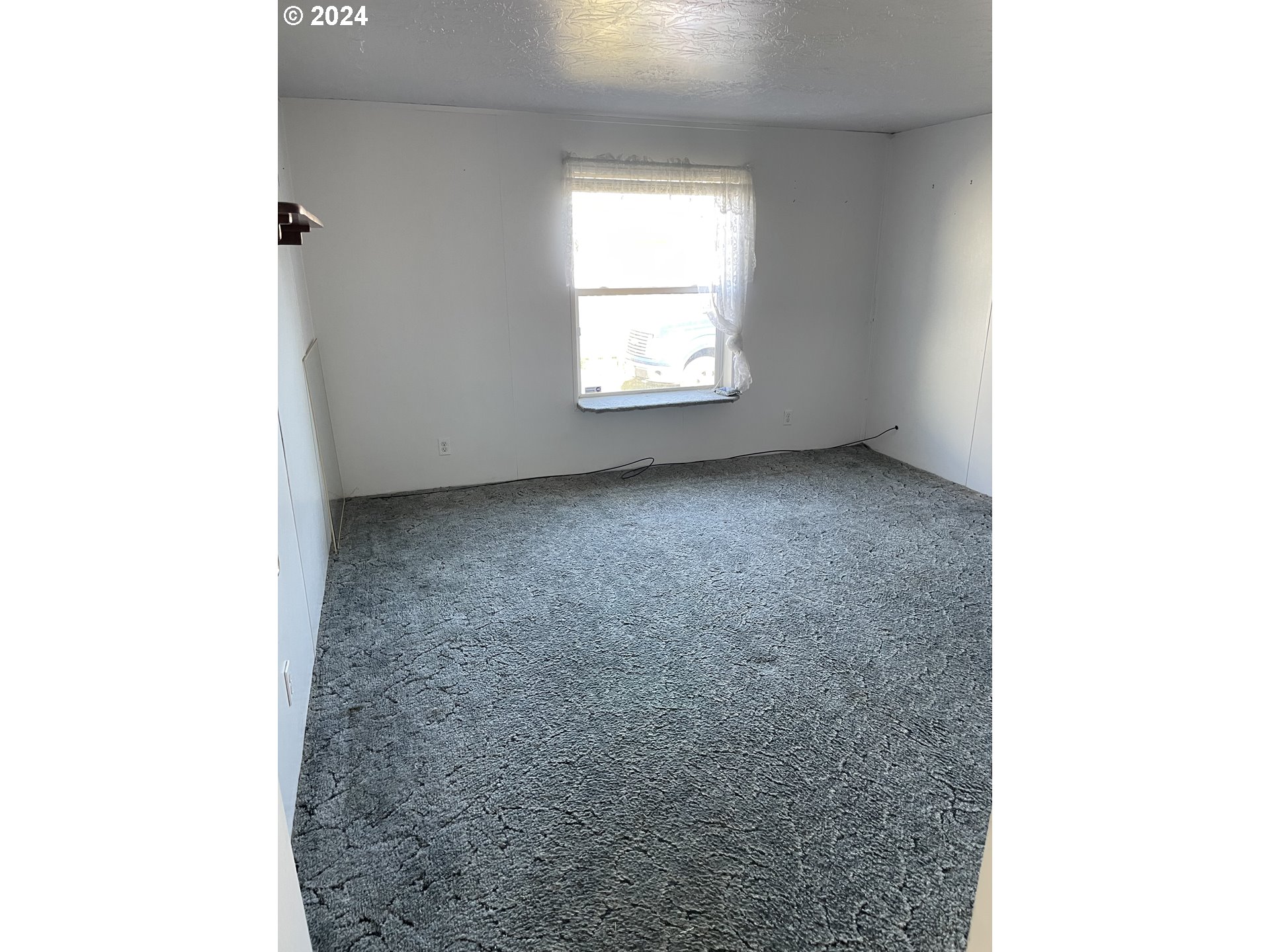 55096 Harrison Road Southwest Bandon, OR 97411 - Photo 21 of 34 a view of empty room with window