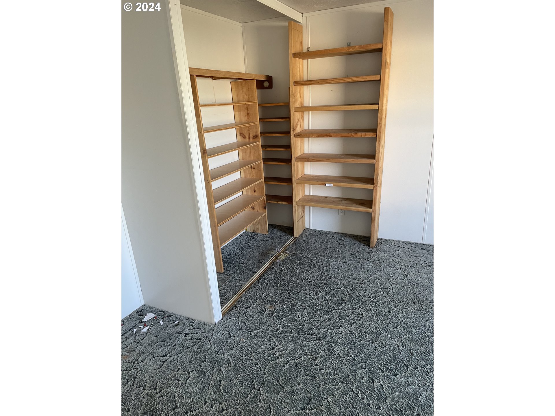 55096 Harrison Road Southwest Bandon, OR 97411 - Photo 25 of 34 a view of walk in closet with empty racks