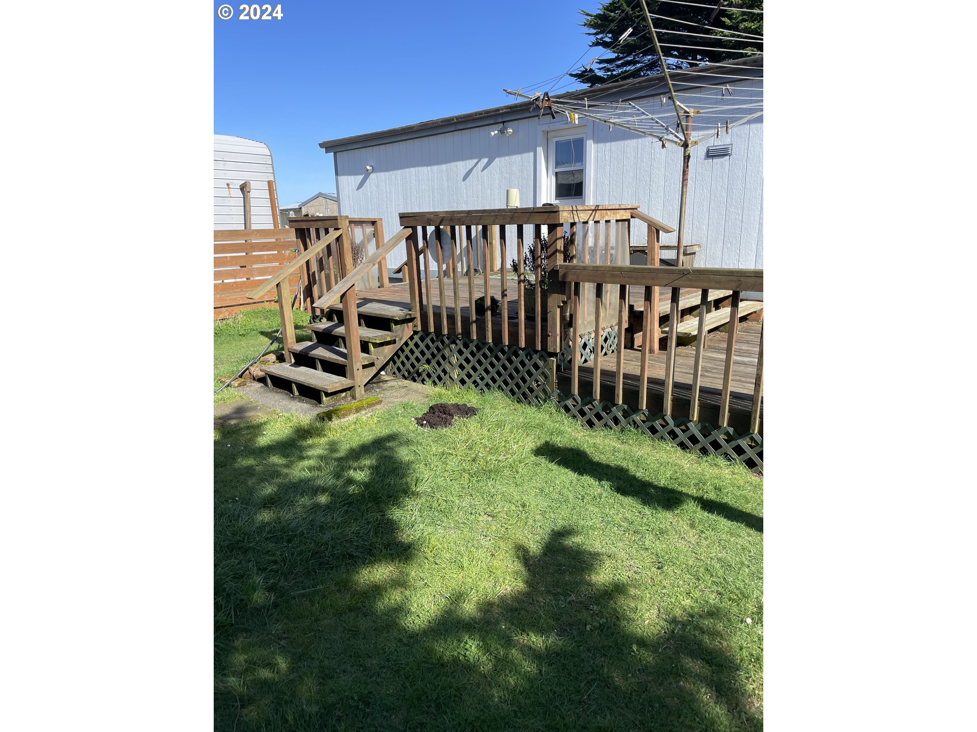 55096 Harrison Road Southwest Bandon, OR 97411 - Photo 26 of 34 a view of a porch with a small yard and plants