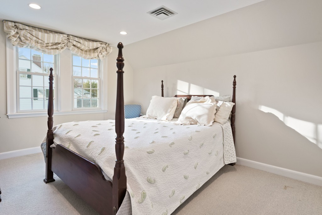 21 Fairway Road Brookline, MA 02467 - Photo 20 of 30 a bed sitting in a bedroom next to a window