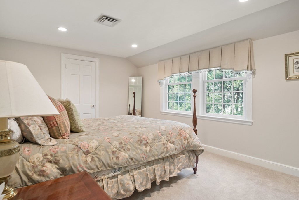 21 Fairway Road Brookline, MA 02467 - Photo 23 of 30 a bedroom with a large bed and a window