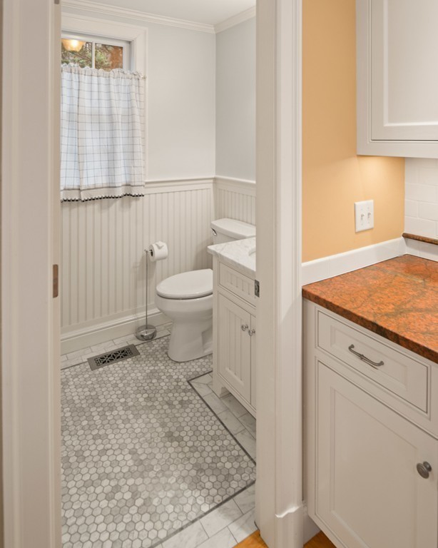 21 Fairway Road Brookline, MA 02467 - Photo 24 of 30 a bathroom with a toilet a sink and a window