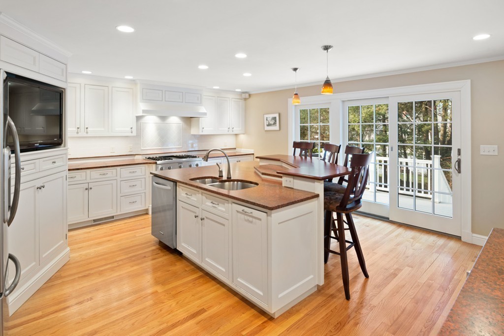 21 Fairway Road Brookline, MA 02467 - Photo 3 of 30 a kitchen with a stove a sink and a refrigerator