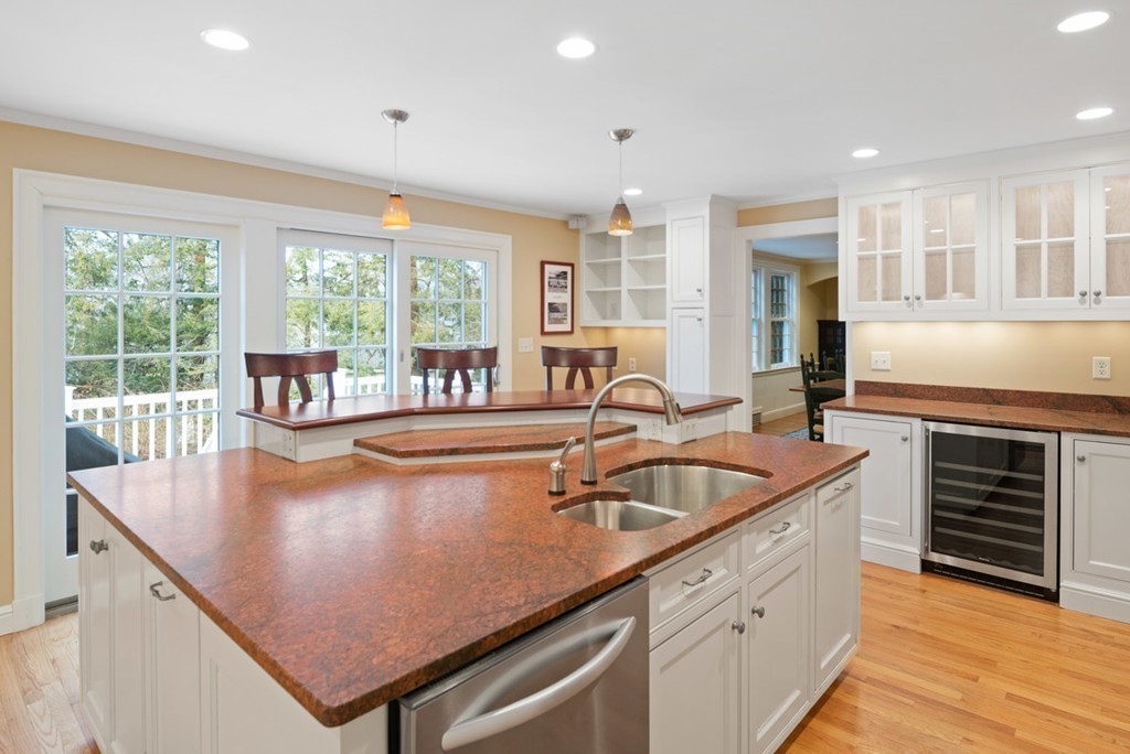 21 Fairway Road Brookline, MA 02467 - Photo 5 of 30 a view of a kitchen with kitchen island a large window a sink and counter space