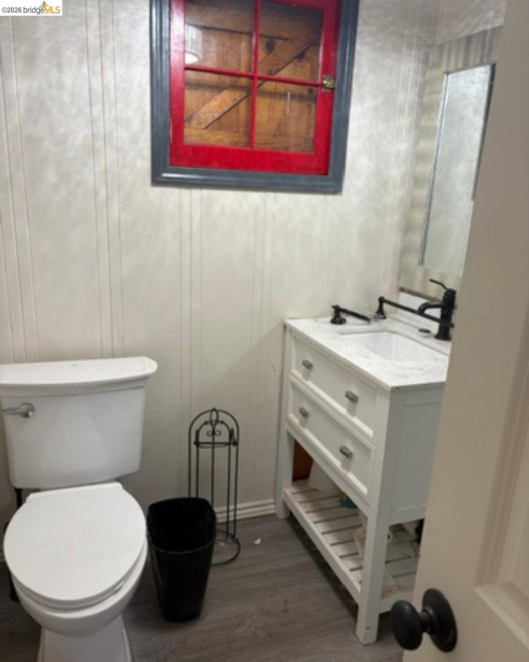 26591 Snow Bowl Road Long Barn, CA 95335 - Photo 18 of 38 a bathroom with a toilet a sink and mirror